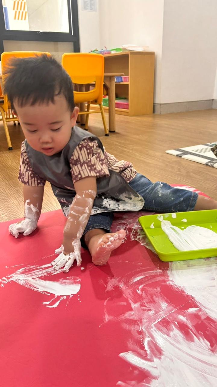Early years child building with colorful construction toys